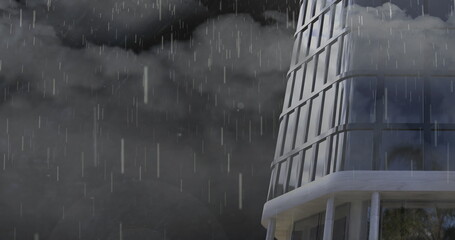 Wall Mural - rain falling and thunderstorm over tall building against dark clouds in the sky