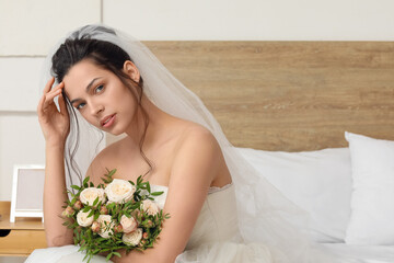 Sticker - Beautiful young bride with wedding bouquet in bedroom