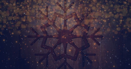 Poster - Image of snow falling and light spots over snowflake on wooden background