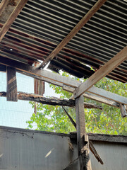 Wall Mural - old wooden fence with rusty metal roof