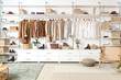 © Pixel-Shot - Interior of modern dressing room with wardrobe boxes, stylish clothes and accessories