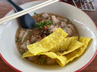 Poster - a photo of noodles with pork and vegetables