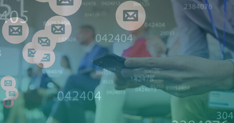 Image of changing numbers and message icons over mid section of a man using smartphone