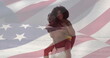 Image of flag of usa over happy african american couple in love on beach