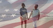 Image of flag of usa over happy senior biracial couple in love walking on beach