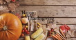 Image of happy thanksgiving day text over vegetables
