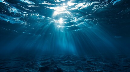 Wall Mural - a blue ocean with sunlight shining through the water's surface