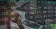 © vectorfusionart - Image of stock market data processing over rear view of biracial woman using laptop at office