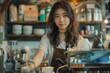 © Old Man Stocker - Asian Barista Working in Coffee Shop. Asian female barista preparing coffee in a busy cafe environment.