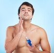 Skincare, portrait and bottle product in studio with natural cosmetics for dermatology routine in morning for clear soft skin. Person, blue background and aftershave for grooming, hygiene and fresh.