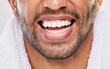 Man, smile and teeth whitening results in studio for health, wellness and bad breath by backdrop. Male person, dental care and mouth of model with happiness for morning, cleaning and tooth grooming