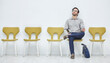 © peopleimages.com - Office, chairs and person for job opportunity, interview and recruitment for selection or human resources. Waiting, area and man candidate for business, corporate and hiring for employment contract