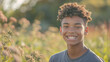 © Keitma - Happy 15 years old teenage boy portrait in middle of beautiful nature of a field with copy space