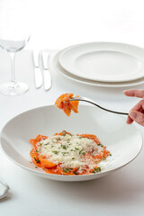 Wall Mural - appetizer of fresh salmon with sauce in a white plate