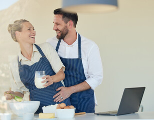 Poster - Couple, bake and love with apron in kitchen, smile and bonding together for food, fun and eggs in house. Happy, man and woman with embrace, entrepreneur and chef in home with flour for dessert