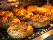 A close up of bagels being baked in an oven.