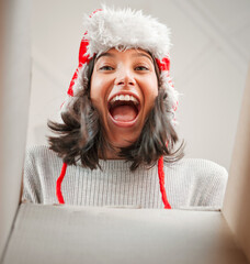 Canvas Print - Girl, pov and opening gift on Christmas with surprise in box on vacation or holiday with happiness, Wow, face and excited unboxing of present or woman shocked with package for celebration of Xmas