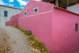 Fototapeta  - Street view of Archanes village in Helakleion, Crete, Greece. Old traditional colorful houses and buildings