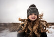 © Cavan Images - Beautiful happy toddler with long blonde curls smiling at camera
