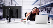 © Andrey Popov - Young Businesswoman Tired Of Calculating Tax At Desk