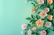 Artistic arrangement of paper flowers and leaves on a pastel green background