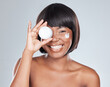 Happy, portrait and black woman with container of cream for skincare or moisturizer on a white studio background. Face of African, female person or model with smile, lotion or spf for dermatology