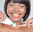 Happy black woman, portrait and toothbrush with toothpaste for dental care on a white studio background. Face of African female person or model with big smile for oral, mouth or gum and hygiene
