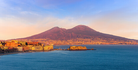 Wall Mural - beautiful panorama of volcano Vesuveus from Naples with blue water of sea gulf, majectic mountain and amazing cloudy sunset sky on background