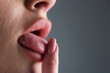© Volodymyr - Nails manicure. Tongue out licking finger. Closeup of female sticking tongue out. Macro tongue lick finger. Close up of woman mouth with tongue. Sexy tongues. Sensual finger lick.
