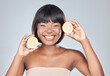 Skincare, portrait and black woman in studio with lemon for wellness, shine or dermatology treatment on grey background. Face, smile or happy girl model with fruit for citrus, benefits or skin detox