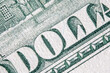 Close up macro image of one hundred US Dollar bill with description: DOLLAR