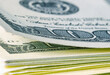 Macro image of stack of US Dollar bills. Selective focus. Horizontal image.