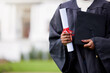 Girl, hands and diploma for graduation in outdoor, certificate and college or education achievement. Female person, student and degree for learning award, scroll and campus ceremony at university