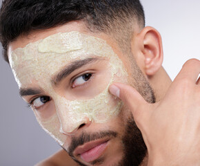 Canvas Print - Apply, skincare or man with face mask for cleaning, detox or healthy pores for beauty in studio. White background, peeling or dermatology cosmetics lotion for natural facial cream product treatment