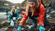 Volunteers collaboratively cleaning a polluted beach, focussed determination on their mission