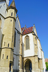 Wall Mural - Part of the facade of the Cathedral of St. Mary in the old town of Sibiu (Romania). Gothic decor in the exterior of a famous Transylvanian church