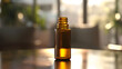 A bottle of aromatherapy essential oil on a table indoors