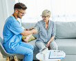 © Lumos sp - nurse doctor senior care caregiver help check exam blood pressure check pulse retirement home stethoscope nursing elderly man woman health