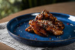 Crispy chicken wings in teriyaki sauce
