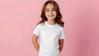 Female child, girl wearing bella canvas white shirt mockup, at pink background. Design tshirt template, print presentation mock-up.