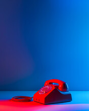 A Red Telephone On A Table.