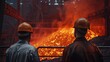 Two steelworkers watch a furnace full of molten metal. Manufacturing industry, smelting, steel lathe a iron melter steel production in the factory