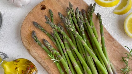 Wall Mural - Fresh Asparagus Arranged on Cutting Board