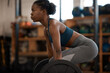 © peopleimages.com - Black woman, fitness and training with barbell in gym for muscle, wellness or body health challenge. Sport, strong bodybuilder and weightlifting for exercise, workout and power for energy in club