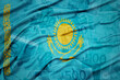 waving colorful national flag of kazakhstan on a euro money banknotes background. finance concept.