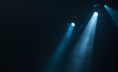 black background with one spotlight beam shining down on the center of it
