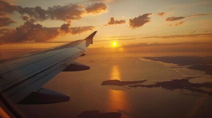 Airplane flying during sunset, wing and land seen from plane window, travel and tourism concept