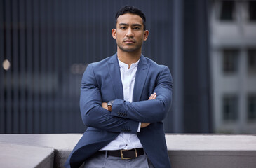 Poster - Serious, crossed arms and portrait of businessman in city for entrepreneur legal career in Mexico. Professional, confident and male corporate lawyer in suit with pride for company in urban town.