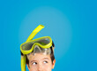 Cropped image of a man with mask tuba and snorkel with thinking about question, thoughtful expression.Concept of doubt and looking aside.Copy space and isolated on blue background