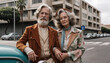 © Dmytriy - An elderly couple in stylish retro clothes, next to a classic car against the backdrop of the city, he is wearing a brown jacket and a striped shirt, and she is wearing a colorful jacket and scarf
